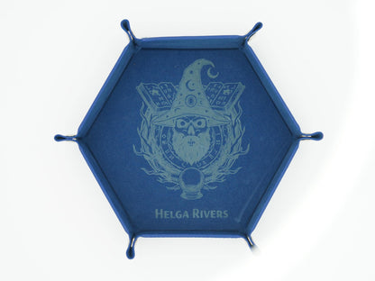 A blue hexagonal metal wall hook rack with five hanging loops, featuring a light blue wizard skull crest and the text 'HELGA RIVERS' on the front, set against a plain white background.